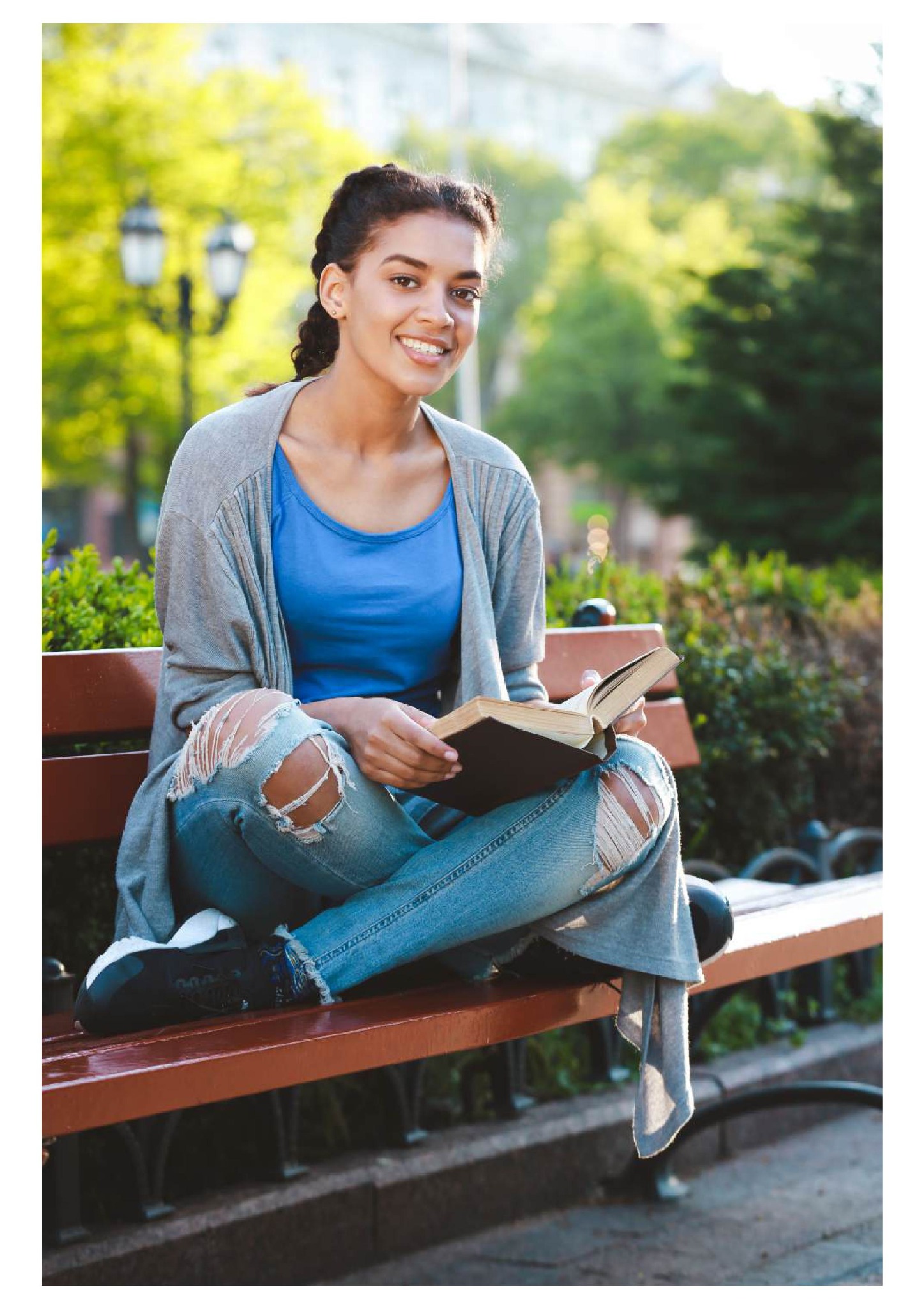 Learner reading outdoors